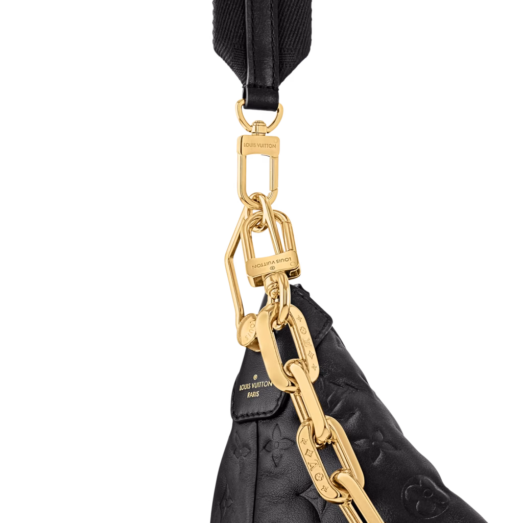 The chain detail on the Coussin Hobo is where softness meets statement—bold, polished, and unapologetically luxe.